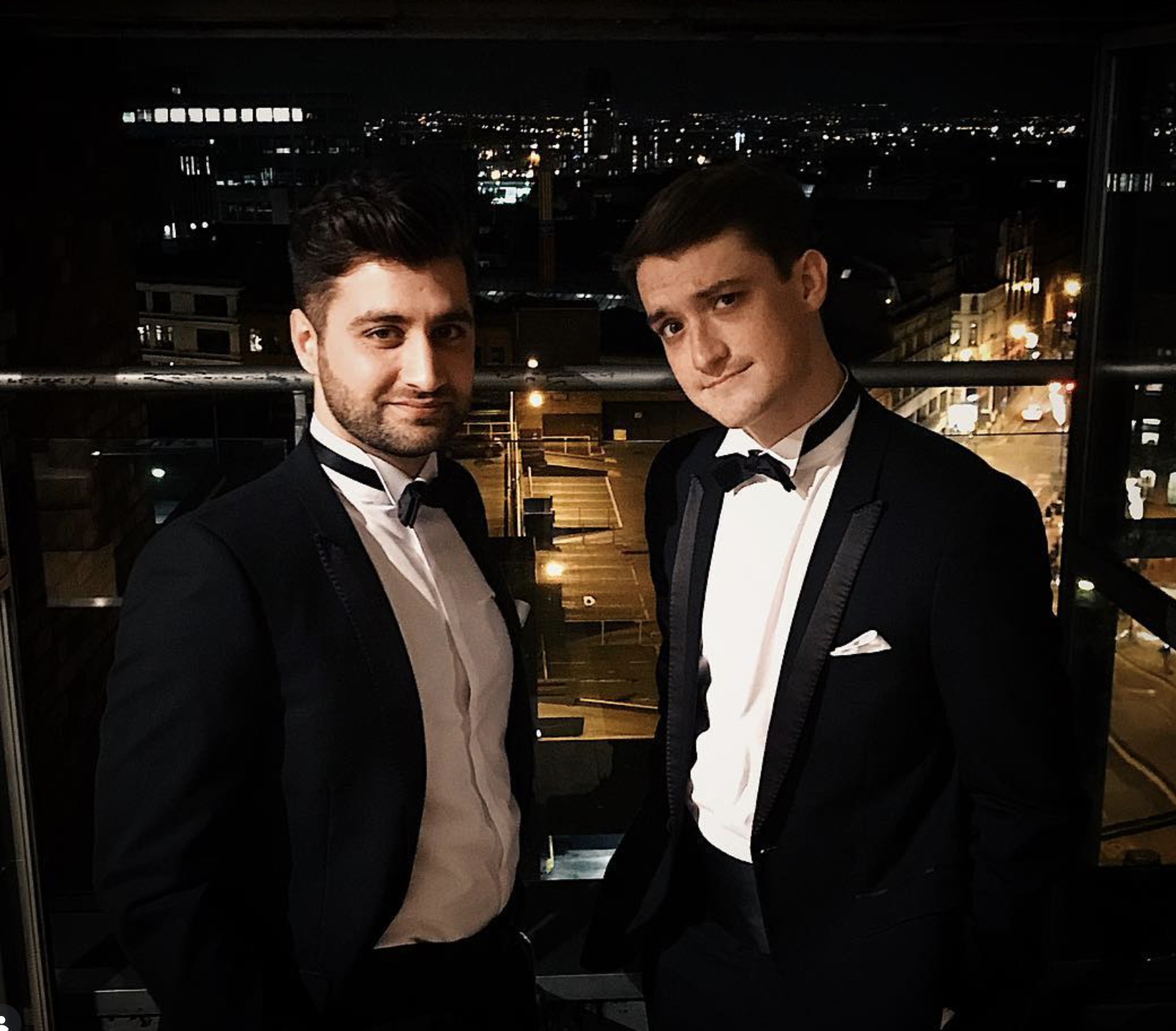 Cam and a colleague in formalwear at an evening event